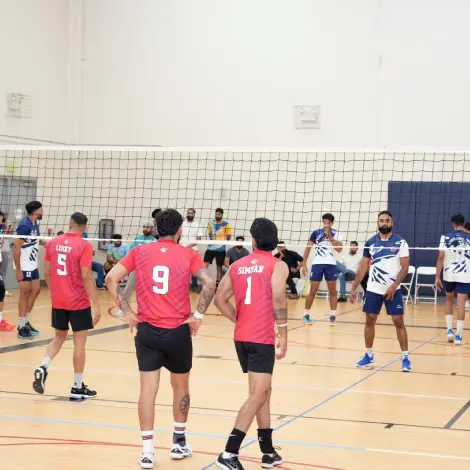 Volleyball players compete during a tournament match in Sacramento.